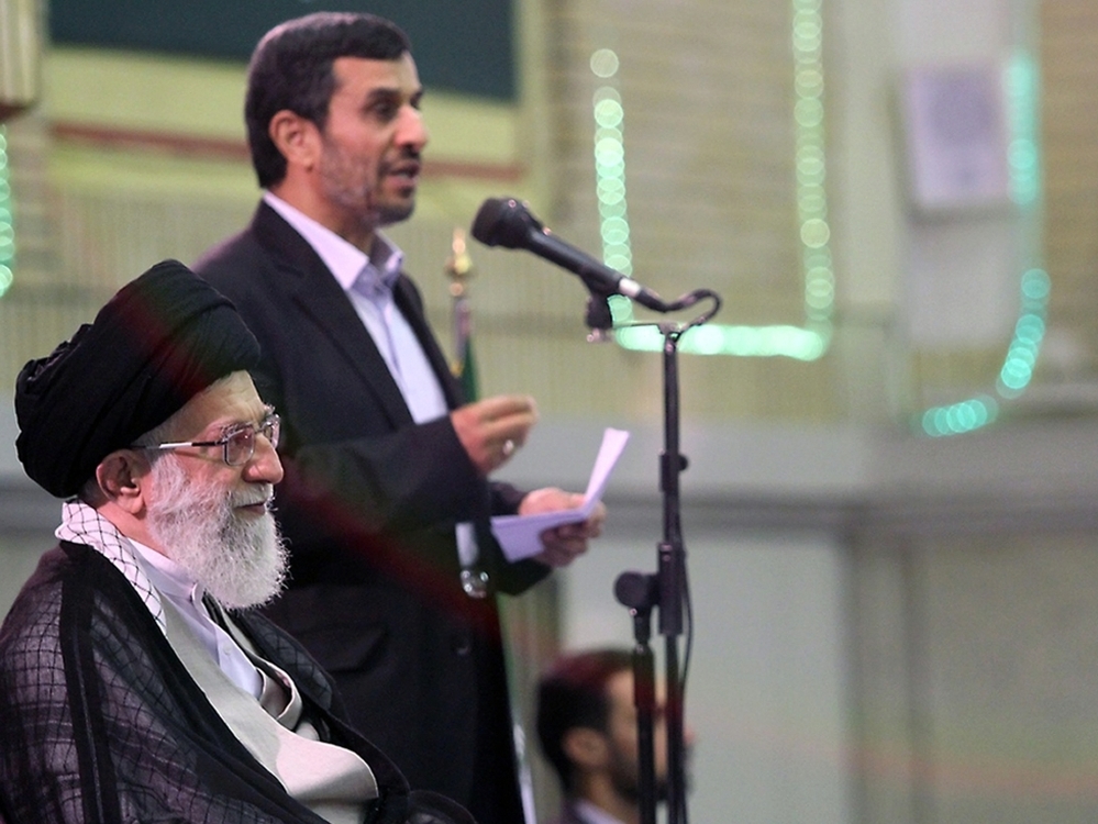 A handout picture released by the official website of Iran's Supreme Leader Ayatollah Ali Khamenei shows Khamenei listening to a speech by President Mahmoud Ahmadinejad (back) during a ceremony with other Iranian top officials and foreign ambassadors to mark the Muslim Eid al-Fitr feast in Tehran on Aug. 31, 2011.