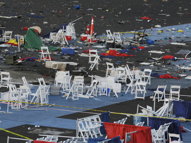 Debris is shown at the Reno Air Races on Saturday, a day after the plane crash. At center left is a crater that authorities say is 6 feet six wide and 3 feet deep where the plane crashed.