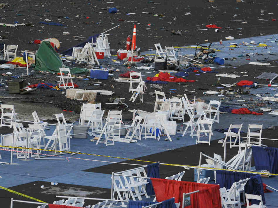 Debris is shown at the Reno Air Races on Saturday, a day after the plane crash. At center left is a crater that authorities say is 6 feet six wide and 3 feet deep where the plane crashed.