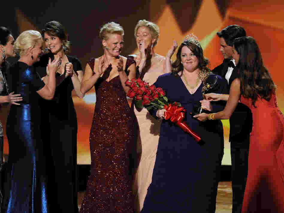 Melissa McCarthy accepts the Outstanding Lead Actress in a Comedy Series award onstage with Amy Poehler, Tina Fey, Martha Plimpton, Edie Falco, and presenters Rob Lowe and Sofia Vergara.
