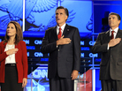 Republican presidential candidates (from left) Rep. Michele Bachmann, former Massachusetts Gov. Mitt Romney and Texas Gov. Rick Perry cover their hearts during the playing of the national anthem before a Republican presidential debate on Sept. 12. Republican presidential candidates (from left) Rep. Michele Bachmann, former Massachusetts Gov. Mitt Romney and Texas Gov. Rick Perry cover their hearts during the playing of the national anthem before a Republican presidential debate on Sept. 12.