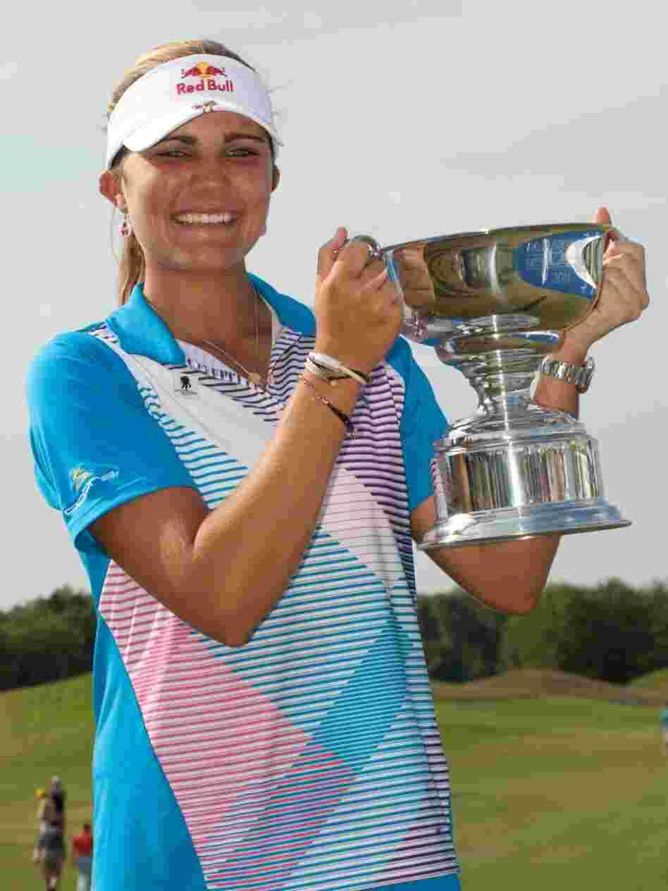 Lexi Thompson holds the champion's trophy after winning the  Navistar LPGA Classic on September 18, 2011 in Prattville, Alabama.