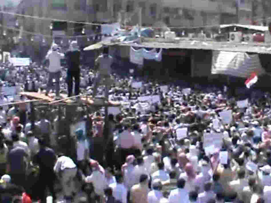 Footage from a YouTube video shows what Syrian activists said was a protest against President Assad's government in the Damascus suburb of Douma on Friday.
