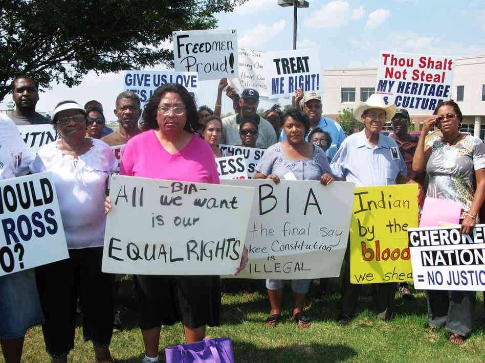 Black Freedmen, who are descended from the slaves of Cherokee Indians, protest their expulsion on Sept. 2 outside a regional Bureau of Indian Affairs office in Muskogee, Okla. Marilyn Vann, in pink, is the president of the Descendants of Freedmen Association. Black Freedmen, who are descended from the slaves of Cherokee Indians, protest their expulsion on Sept. 2 outside a regional Bureau of Indian Affairs office in Muskogee, Okla. Marilyn Vann, in pink, is the president of the Descendants of Freedmen Association.