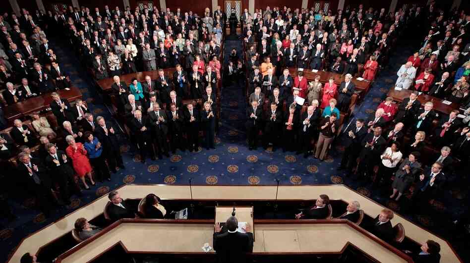Members of the U.S. Congress applaud during a joint session at the U.S. Capitol. Nearly 50 percent of those in Congress are millionaires and may be affected by President Obama's tax proposal. Members of the U.S. Congress applaud during a joint session at the U.S. Capitol. Nearly 50 percent of those in Congress are millionaires and may be affected by President Obama's tax proposal.