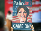 A supporter holds up a sign as former Alaska Gov. Sarah Palin speaks during the Tea Party of America's "Restoring America" event at the Indianola Balloon Festival Grounds in Indianola, Iowa. A supporter holds up a sign as former Alaska Gov. Sarah Palin speaks during the Tea Party of America's "Restoring America" event at the Indianola Balloon Festival Grounds in Indianola, Iowa.