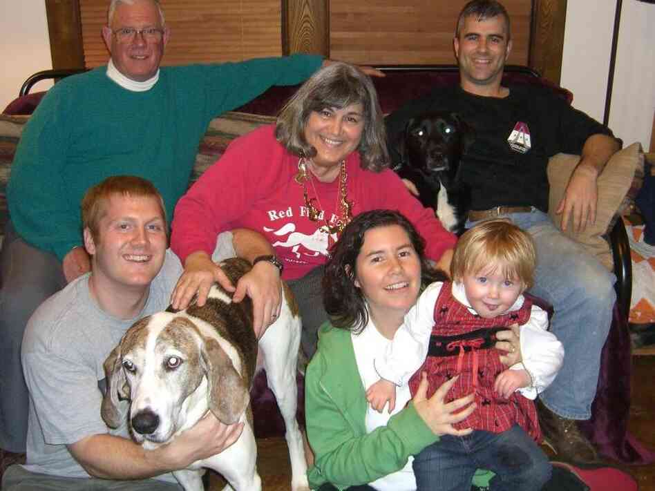 Annmarie sits in the front with her daughter, her husband and her beloved dog, Hound.