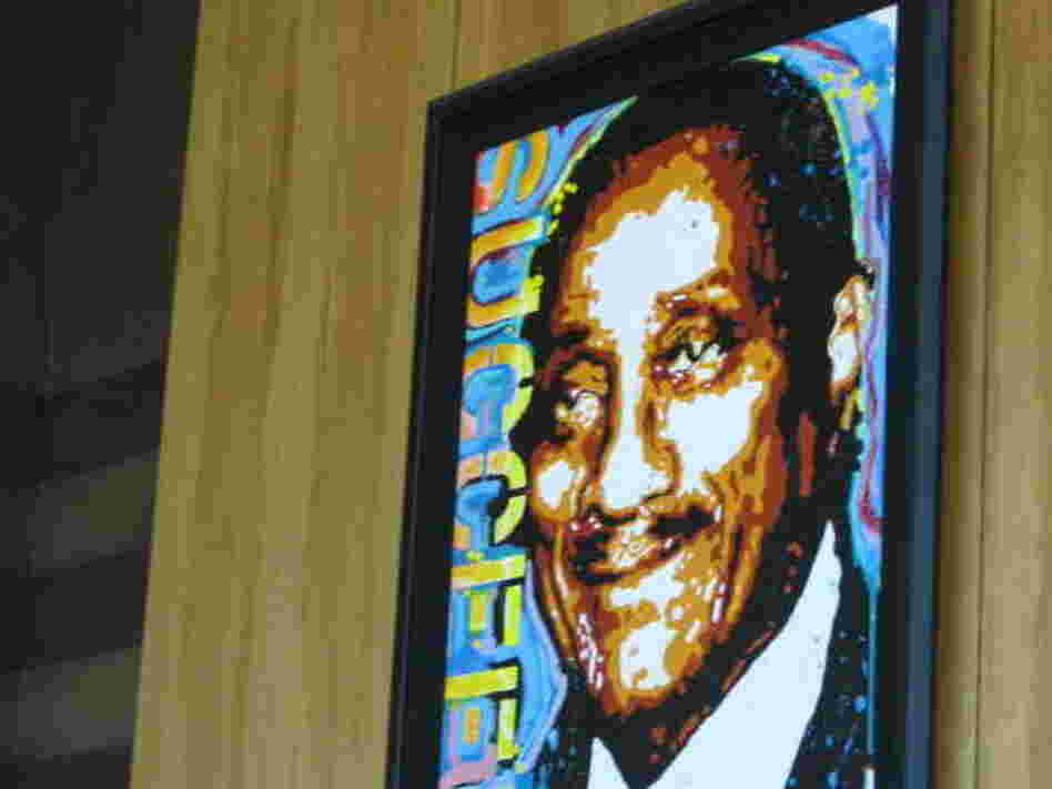 A portrait of Johnson Publishing Co. founder John H. Johnson hangs in the company's lobby, embellished with the word "succeed." Ebony's September issue included an article on how to raise a high achiever.