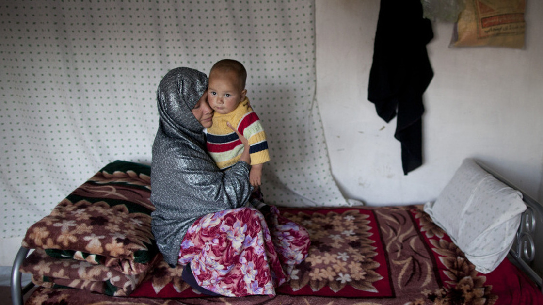 Sakina sits with her 18-month-old son, Shafiq, at a women's shelter in Bamiyan, in central Afghanistan, last October. Sakina spent seven months in prison for leaving a forced marriage. The Afghan government recently backed down from a plan to take control of women's shelters, and women's groups are hailing it as a victory.