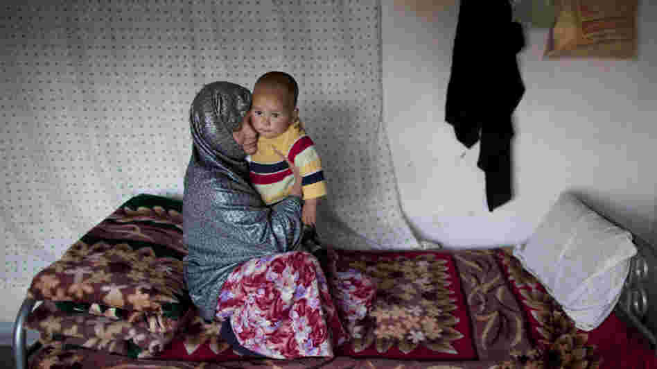 Sakina sits with her 18-month-old son, Shafiq, at a women's shelter in Bamiyan, in central Afghanistan, last October. Sakina spent seven months in prison for leaving a forced marriage. The Afghan government recently backed down from a plan to take control of women's shelters, and women's groups are hailing it as a victory.