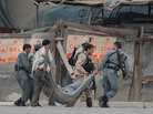 Afghan security personnel carry a wounded colleague across a street in Kabul on Sept. 14, after Taliban fighters attacked the most heavily protected part of the Afghan capital. Adm. Mike Mullen, chairman of the Joint Chiefs of Staff, said Thursday before a Senate panel that the Haqqani network of militants, supported by Pakistan, was responsible for this attack, among others. Afghan security personnel carry a wounded colleague across a street in Kabul on Sept. 14, after Taliban fighters attacked the most heavily protected part of the Afghan capital. Adm. Mike Mullen, chairman of the Joint Chiefs of Staff, said Thursday before a Senate panel that the Haqqani network of militants, supported by Pakistan, was responsible for this attack, among others.