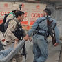 Afghan security personnel carry a wounded colleague across a street in Kabul on Sept. 14, after Taliban fighters attacked the most heavily protected part of the Afghan capital. Adm. Mike Mullen, chairman of the Joint Chiefs of Staff, said Thursday before a Senate panel that the Haqqani network of militants, supported by Pakistan, was responsible for this attack, among others.