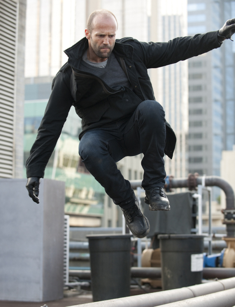 Statham plays his usual charismatic stoic — leaping tall buildings and wooing stunning women as he chases down the bad guys.