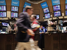 Traders work on the floor of the New York Stock Exchange during morning trading on Thursday. Traders work on the floor of the New York Stock Exchange during morning trading on Thursday.