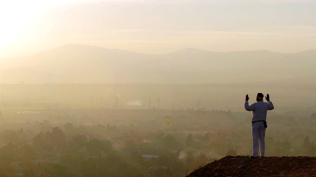 Living in the past: A man greets the spring equinox on top of a pyramid at Teotihuacan, Mexico.