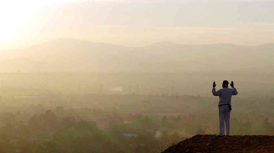 Living in the past: A man greets the spring equinox on top of a pyramid at Teotihuacan, Mexico.