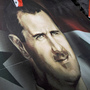 Supporters of Syrian President Bashar Assad carry a giant flag with his image on it during a pro-regime protest in Damascus, Syria, in August. Pro-government forces are now taking their message to a new arena: cyberspace. Supporters of Syrian President Bashar Assad carry a giant flag with his image on it during a pro-regime protest in Damascus, Syria, in August. Pro-government forces are now taking their message to a new arena: cyberspace.