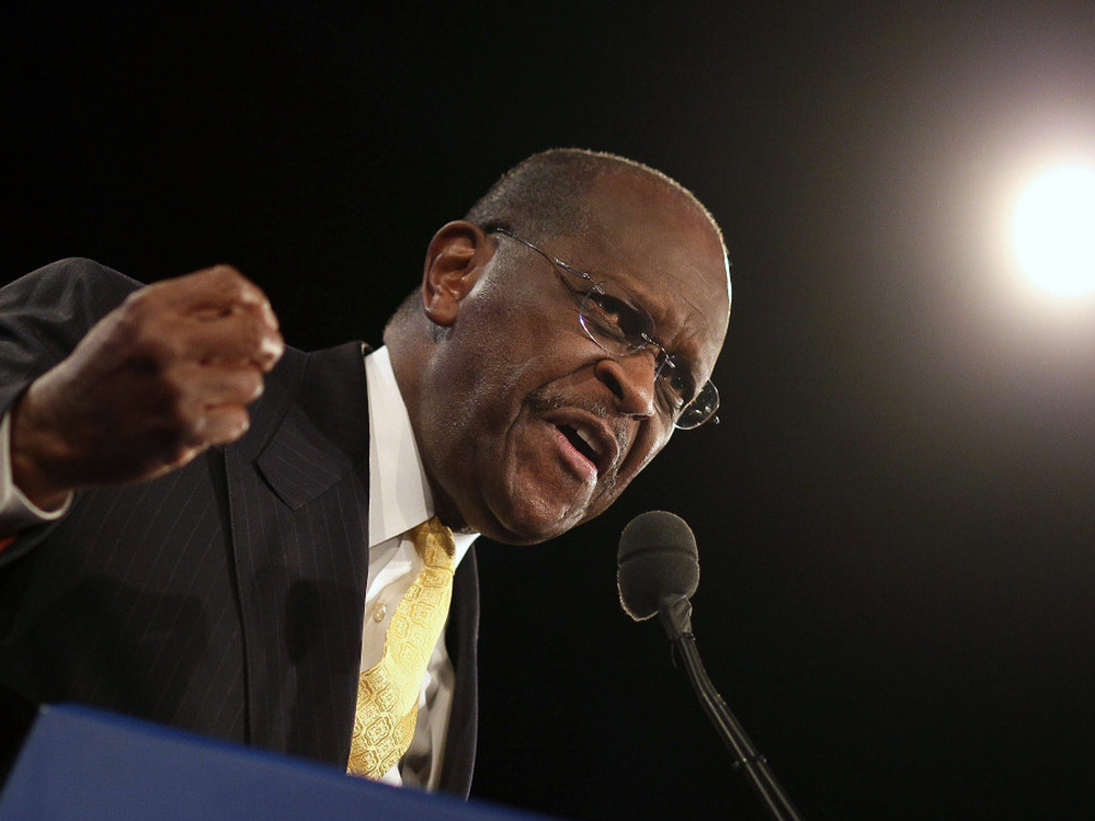 Herman Cain speaks prior to Florida's straw poll at the Orange County Convention Center on Saturday in Orlando.  Cain was a clear winner in the non-binding poll.