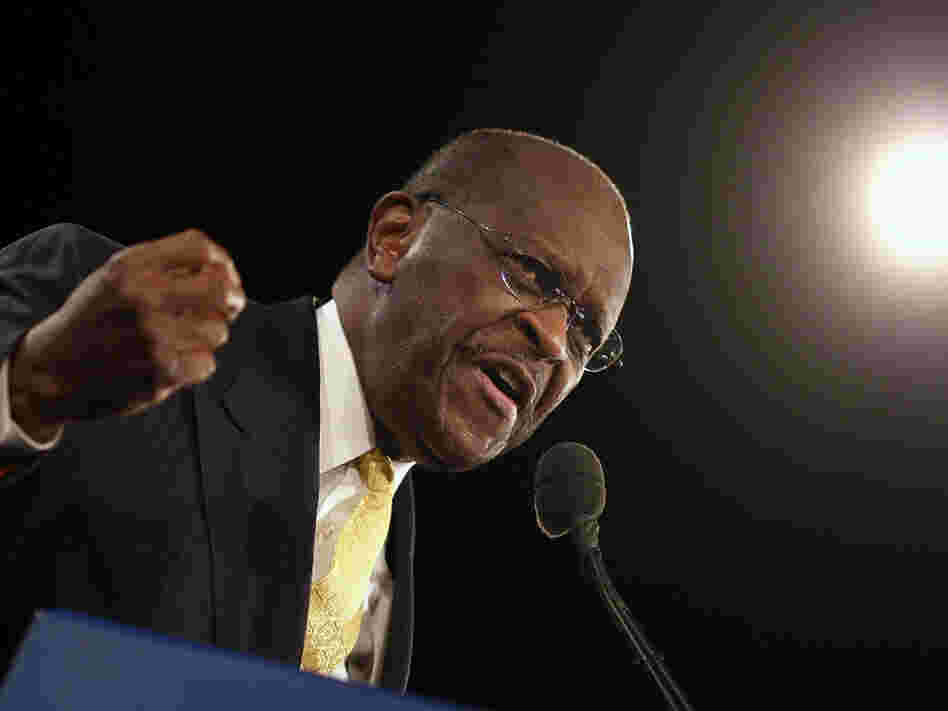 Herman Cain speaks prior to Florida's straw poll at the Orange County Convention Center on Saturday in Orlando.  Cain was a clear winner in the non-binding poll.