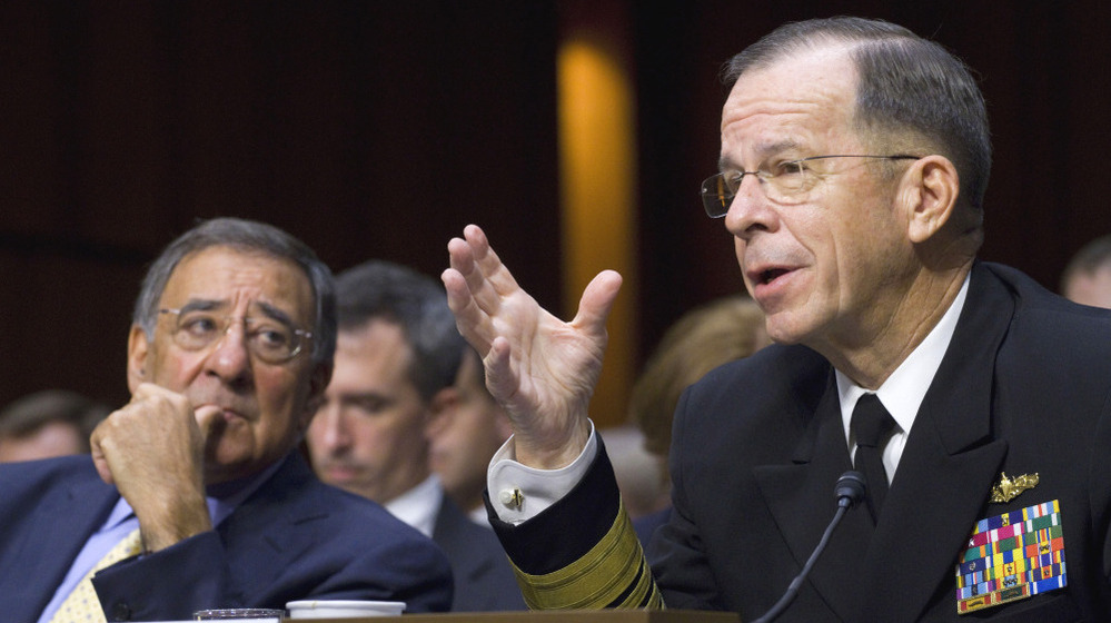 Defense Secretary Leon Panetta looks on at left as Joint Chiefs Chairman Adm. Michael Mullen testifies Thursday in Washington.