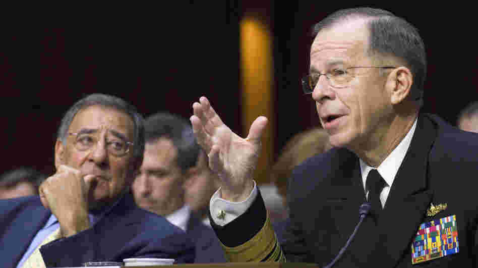 Defense Secretary Leon Panetta looks on at left as Joint Chiefs Chairman Adm. Michael Mullen testifies Thursday in Washington.