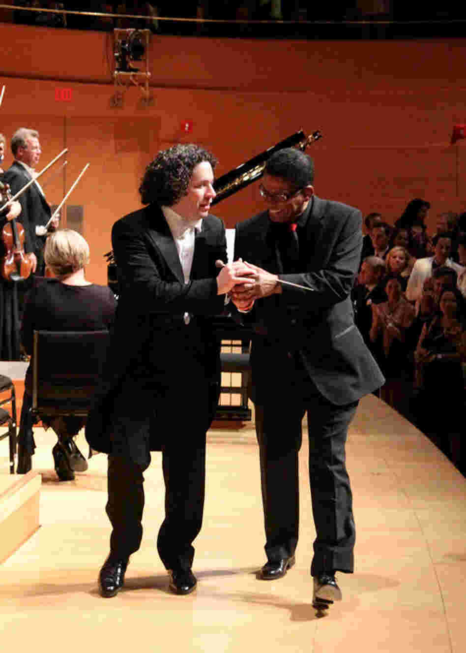 Dudamel and Hancock share a moment walking offstage.