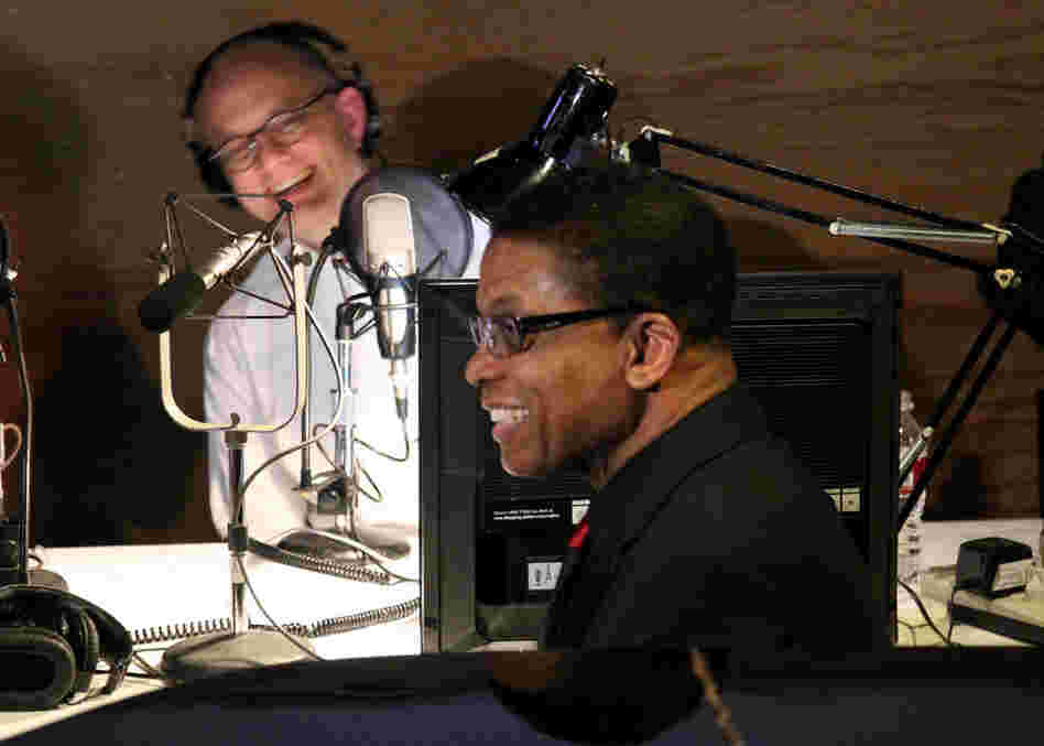Pianist Herbie Hancock shares a laugh with American Public Media's Brian Newhouse backstage before his performance.
