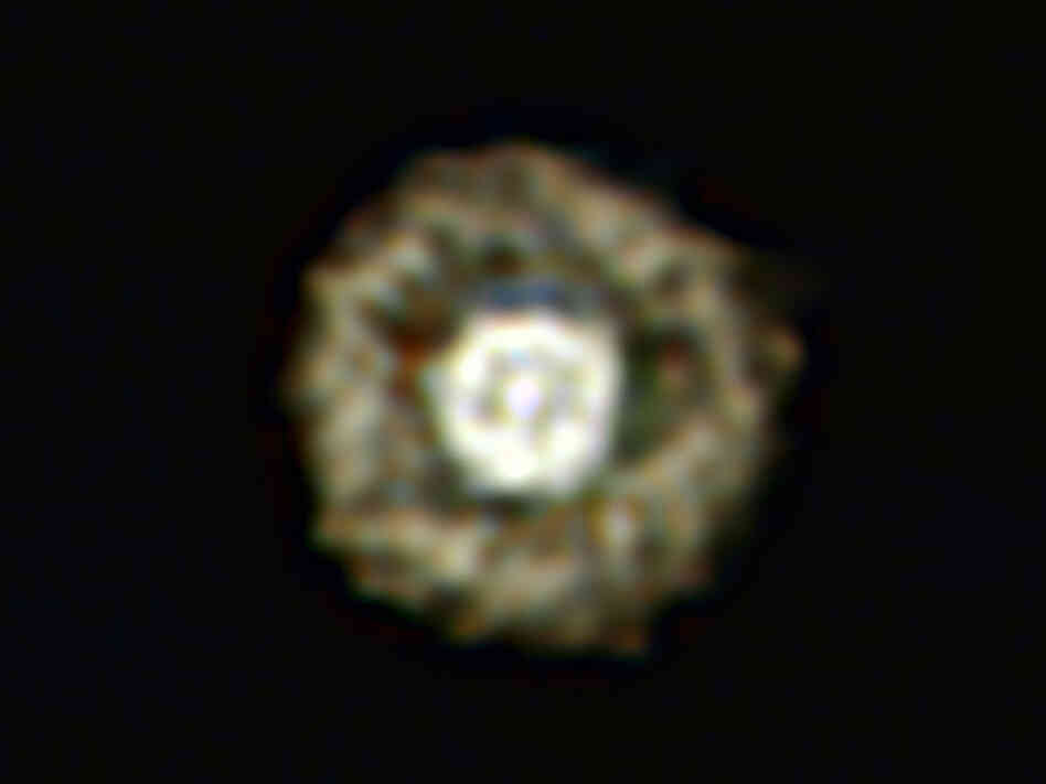 This picture of the nebula around a rare yellow hypergiant star called  IRAS 17163-3907 is the best ever taken of a star in this class and shows  for the first time a huge dusty double shell surrounding the central  hypergiant. The star and its shells resemble an egg white around a yolky  center, leading astronomers to nickname the object the Fried Egg  Nebula.