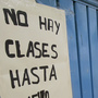 In Acapulco, Mexico, teachers are out on strike at more than a hundred schools because of spiraling violence related to the country's drug war. Here, a child looks at a sign announcing the closure of a school in Acapulco, Sept. 1. In Acapulco, Mexico, teachers are out on strike at more than a hundred schools because of spiraling violence related to the country's drug war. Here, a child looks at a sign announcing the closure of a school in Acapulco, Sept. 1.