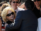 Anita Perry is increasingly stepping out from behind her husband, Republican presidential candidate and Texas Gov. Rick Perry. Wednesday she'll campaign solo in Iowa. Here they greeted supporters together during a rally on Sept. 8 in Newport Beach, Calif. Anita Perry is increasingly stepping out from behind her husband, Republican presidential candidate and Texas Gov. Rick Perry. Wednesday she'll campaign solo in Iowa. Here they greeted supporters together during a rally on Sept. 8 in Newport Beach, Calif.