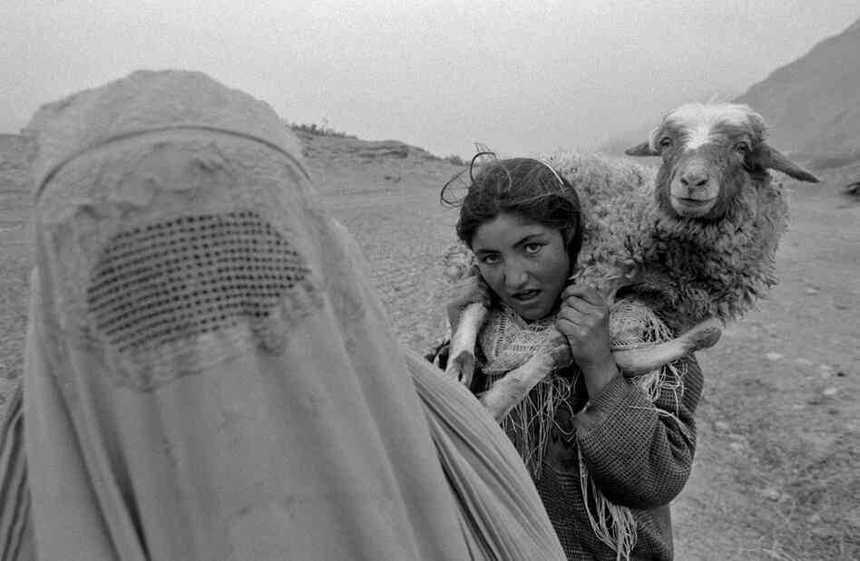 A mother and daughter returning home from work in the fields, Badakhshan Province, 2004.