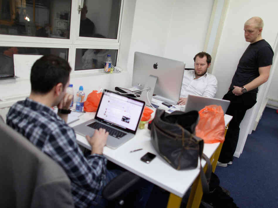 Small startup companies have an advantage, says author Eric Ries: they can test innovative ideas quickly. Here, workers in London talk at TechHub, an office space for technology entrepreneurs.