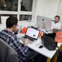 Small startup companies have an advantage, says author Eric Ries: they can test innovative ideas quickly. Here, workers in London talk at TechHub, an office space for technology entrepreneurs.