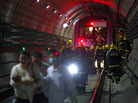 Rescue workers evacuated passengers after a subway train crashed into another train between stations Tuesday in Shanghai. Rescue workers evacuated passengers after a subway train crashed into another train between stations Tuesday in Shanghai.