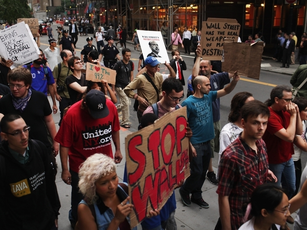Demonstrators opposed to corporate profits on Wall Street march in the Financial District on September 26, 2011 New York City.