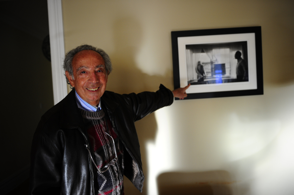 Former Chelsea Hotel manager Stanley Bard shows off a picture of actress Marilyn Monroe and playwright Arthur Miller taken in room 614 — where Miller lived during the 1960s. The artist community flourished under Bard's leadership for 50 years, before he was ousted by the hotel's board of directors in 2007.