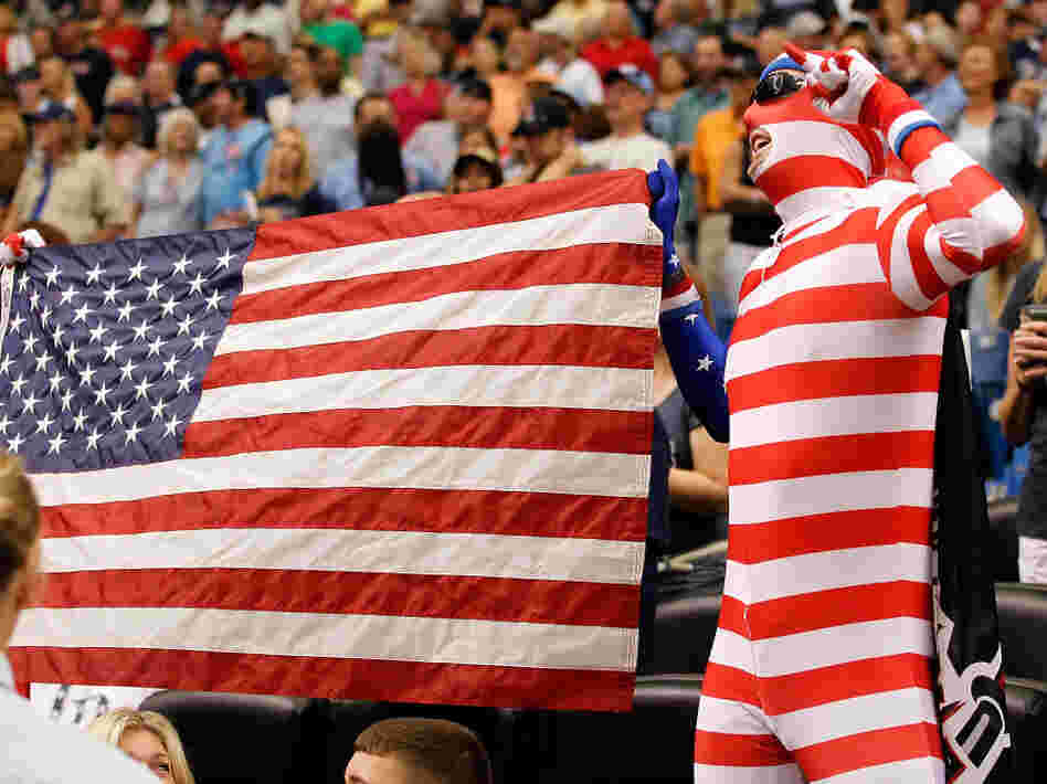 Fans of the Tampa Bay Rays celebrate during the singing of "God Bless America" during the game against the Boston Red Sox at Tropicana Field on Sept. 11 in St. Petersburg, Fla. Fans of the Tampa Bay Rays celebrate during the singing of "God Bless America" during the game against the Boston Red Sox at Tropicana Field on Sept. 11 in St. Petersburg, Fla.