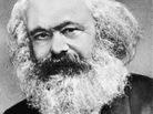 In the Communist Manifesto, Karl Marx (above) and Friedrich Engels used the German word Klassenkampfen, which translates as "class struggles." Their critics rendered it as "class warfare." In the Communist Manifesto, Karl Marx (above) and Friedrich Engels used the German word Klassenkampfen, which translates as "class struggles." Their critics rendered it as "class warfare."