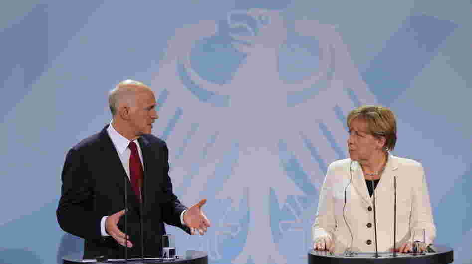 German Chancellor Angela Merkel and Greek Prime Minister George Papandreou speak during talks Tuesday in Berlin. Germany's lower house of parliament voted 523-85 to bolster the European bailout fund, which is designed to help Greece and other troubled countries. German Chancellor Angela Merkel and Greek Prime Minister George Papandreou speak during talks Tuesday in Berlin. Germany's lower house of parliament voted 523-85 to bolster the European bailout fund, which is designed to help Greece and other troubled countries.