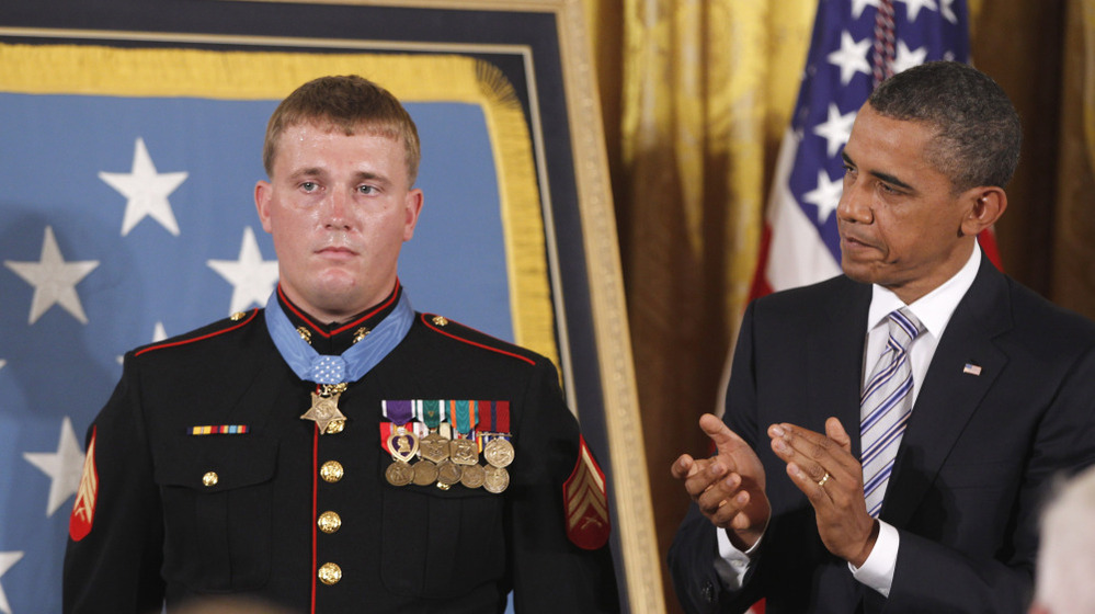 President Barack Obama applauds former Marine Cpl. Dakota Meyer, 23, on Thursday, Sept. 15, 2011, after awarding him the Medal of Honor at the White House.