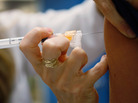 University of Miami pediatrician Judith L. Schaechter gives an HPV vaccination to a 13-year-old girl last week in Miami. University of Miami pediatrician Judith L. Schaechter gives an HPV vaccination to a 13-year-old girl last week in Miami.