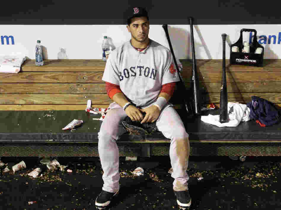 The agony: Boston Red Sox third baseman Mike Aviles sits in the dugout after his team's 4-3 loss to the Baltimore Orioles Wednesday (Sept. 28, 2011).