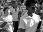 Elizabeth Eckford (right) attempts to enter Little Rock High School on Sept. 4, 1957, while Hazel Bryan (left) and other segregationists protest. The book Elizabeth and Hazel chronicles not just that event but the months and years that came after in the two women's lives.