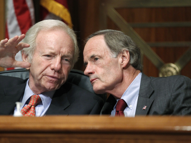 During a hearing on the troubles of the U.S. Postal Service, Sen. Joseph I. Lieberman (I-CT), left, confers with Sen. Tom Carper (D-DE), who chairs the Senate subcommittee that oversees the Postal Service.