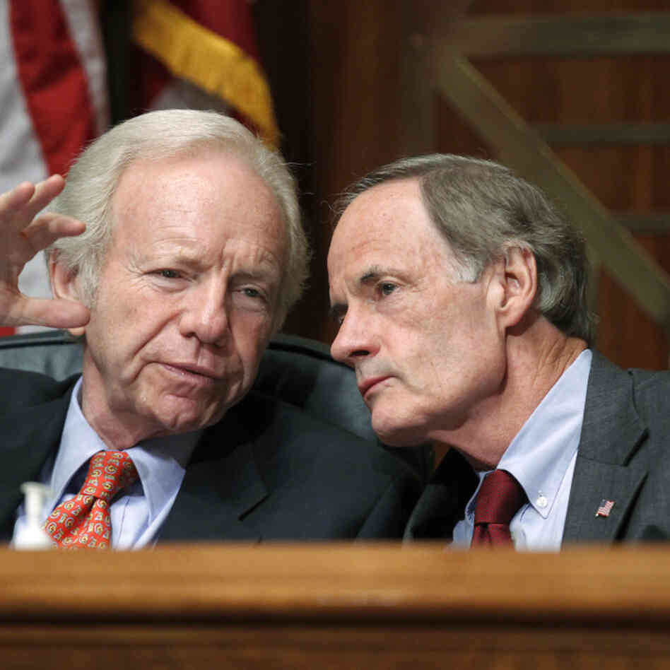 During a hearing on the troubles of the U.S. Postal Service, Sen. Joseph I. Lieberman (I-CT), left, confers with Sen. Tom Carper (D-DE), who chairs the Senate subcommittee that oversees the Postal Service.
