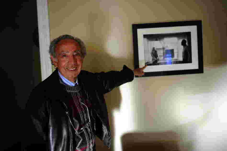 Former manager Stanley Bard, standing in room 614, points out a photograph of actress Marilyn Monroe and playwright Arthur Miller, taken in that same room. Miller lived in 614 for several years during the 1960s. 