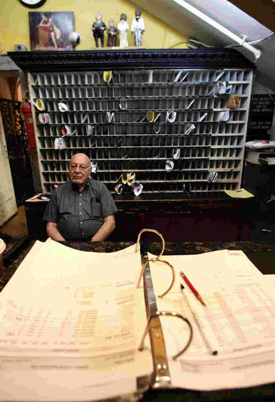 Front desk manager Jerry Weinstein is shown on duty in June 2007. Since then, most of the Chelsea staff have been let go. "It was like we didn't have family anymore," says long-term resident Nicola L. 