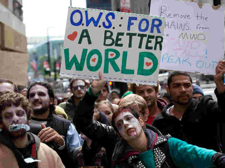 Protesters march through New York's financial district dressed as corporate zombies on Monday. 