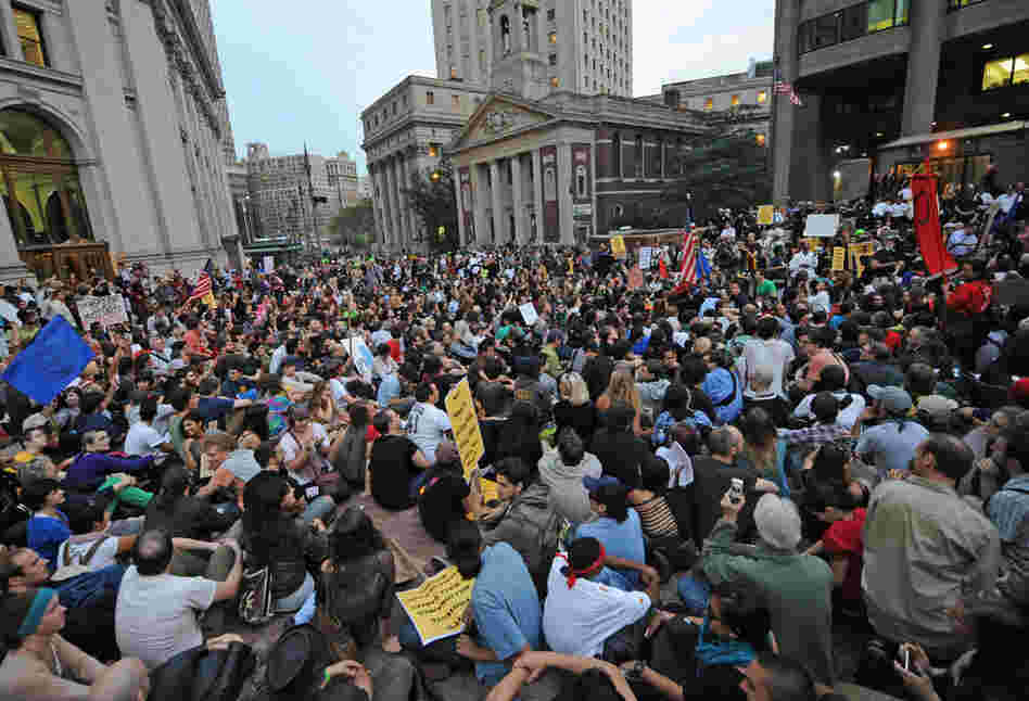 Protesters in New York sit in the plaza of police headquarters on Sept. 30. 