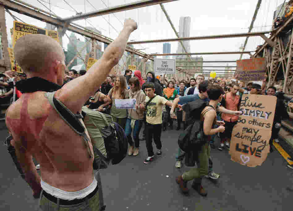 A large group of Occupy Wall Street protesters demonstrating against corporate greed and social inequality, among other grievances, attempt to cross the Brooklyn Bridge in New York on Oct. 1, effectively shutting down parts of the bridge. 
